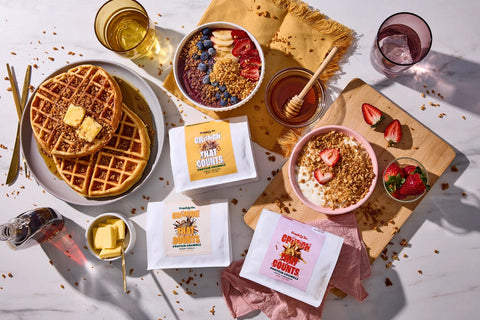 Frankly So sweet protein crumbles in use — Honey Roasted on waffles and an acai bowl, Warm Vanilla & Apple Cinnamon on yogurt with berries.