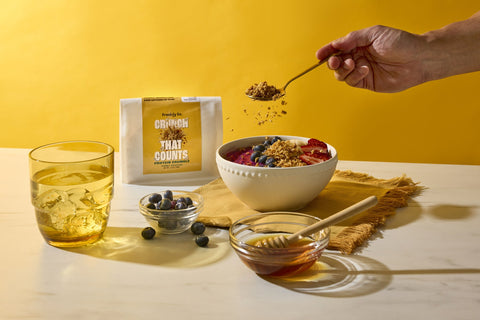 Honey Roasted Protein Crumble sprinkled over a yogurt bowl